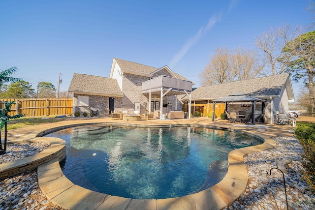 view of swimming pool featuring a gazebo, a patio, fence, and a fenced in pool