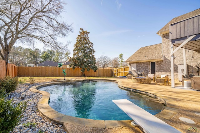 view of pool featuring a patio area, an outdoor fire pit, a fenced in pool, and a fenced backyard