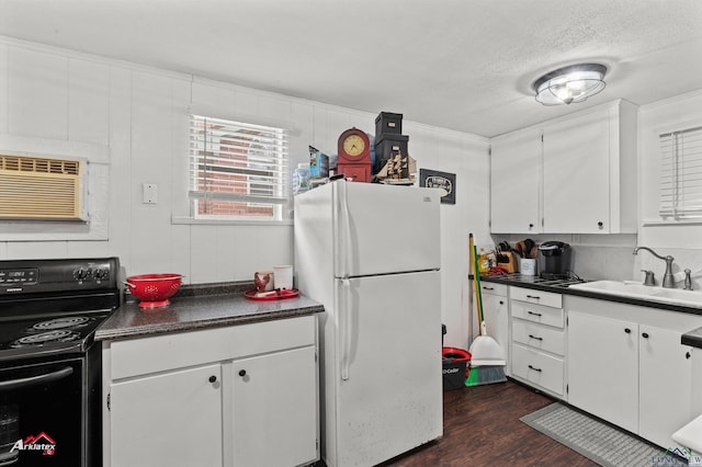 kitchen with white cabinetry, black electric range oven, sink, white refrigerator, and a wall unit AC