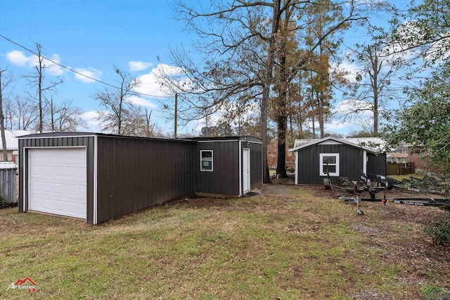 exterior space with a garage and an outdoor structure