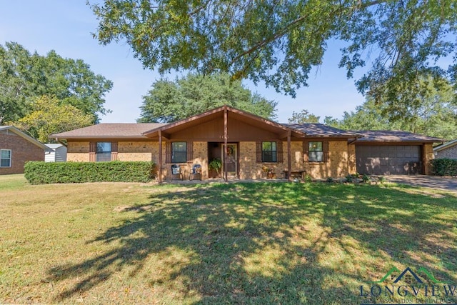 single story home with a front yard and a garage