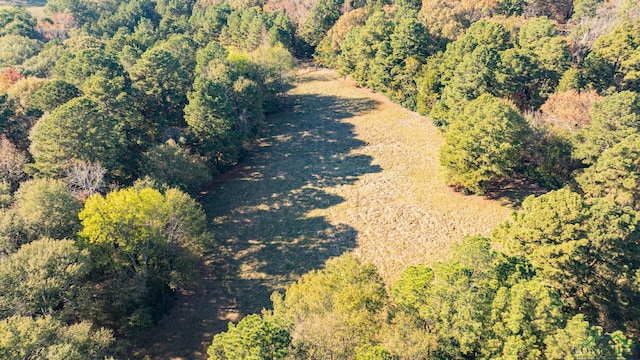 drone / aerial view featuring a view of trees