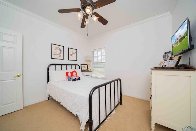bedroom featuring crown molding, baseboards, a ceiling fan, and light colored carpet