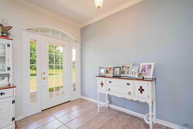 entryway featuring crown molding, baseboards, and light tile patterned floors