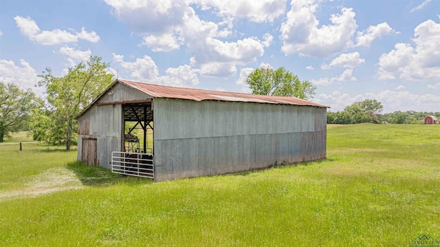 view of pole building with a yard