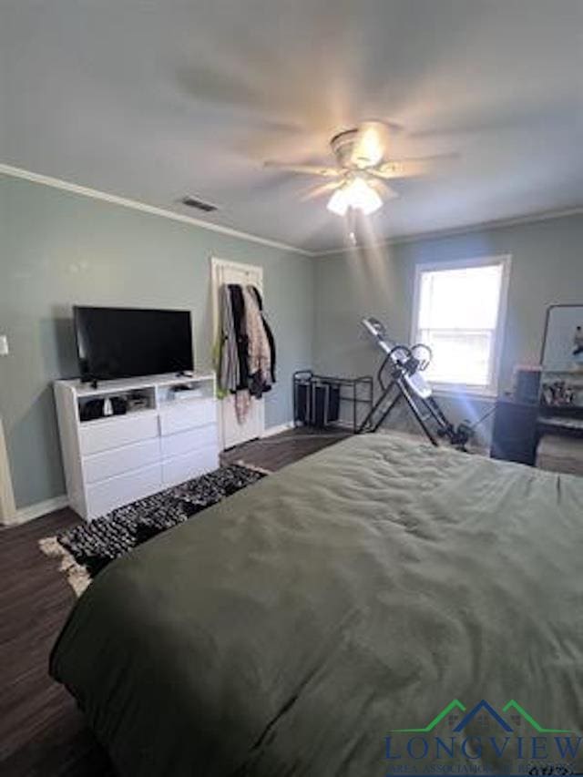 204 Mount Sylvan St, Lindale, TX 75771 - bedroom with crown molding, wood finished floors, and ceiling fan
