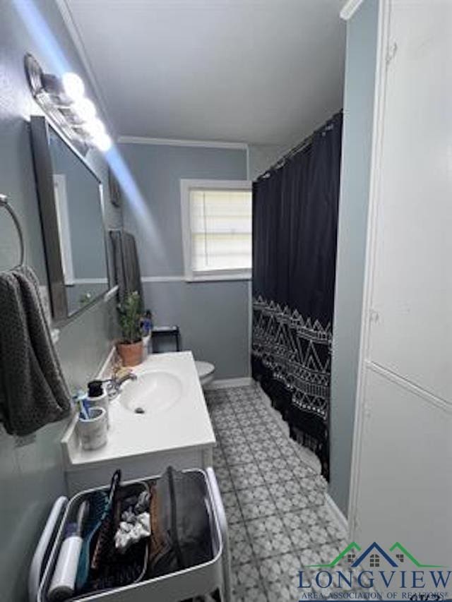 204 Mount Sylvan St, Lindale, TX 75771 - full bath with tile patterned floors, vanity, curtained shower, and crown molding