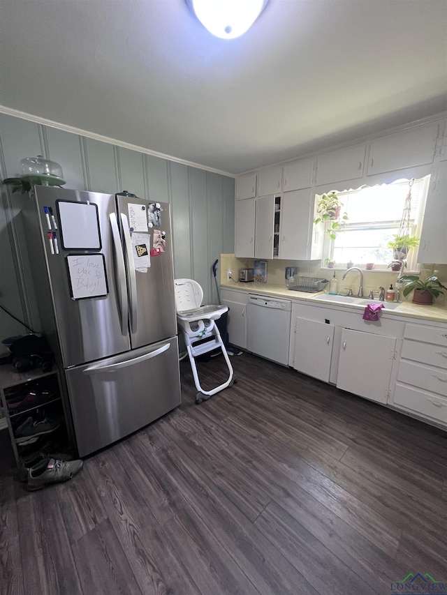 204 Mount Sylvan St, Lindale, TX 75771 - kitchen featuring dishwasher, freestanding refrigerator, light countertops, dark wood-style flooring, and white cabinets