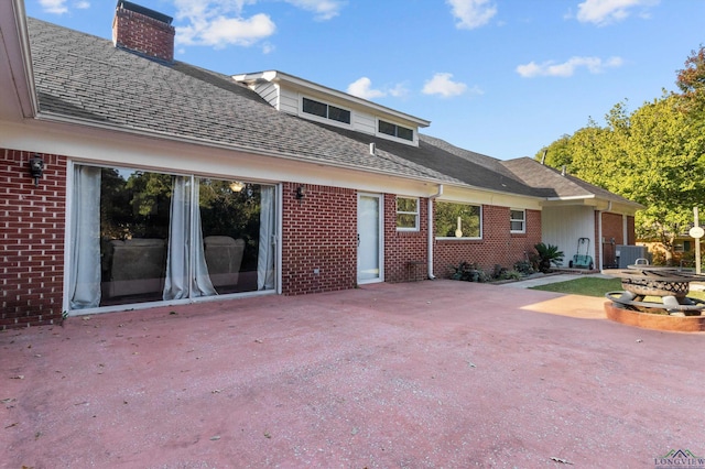 back of house with a patio