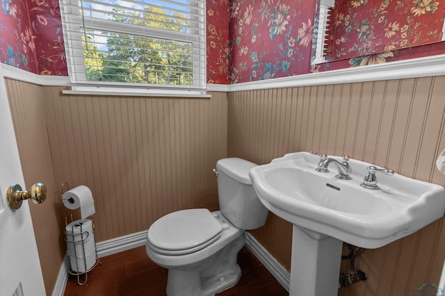 bathroom featuring hardwood / wood-style floors and toilet