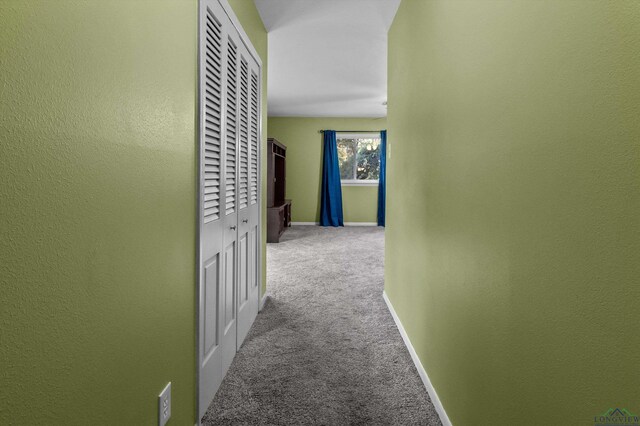 corridor with carpet flooring