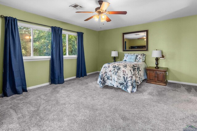 carpeted bedroom with ceiling fan