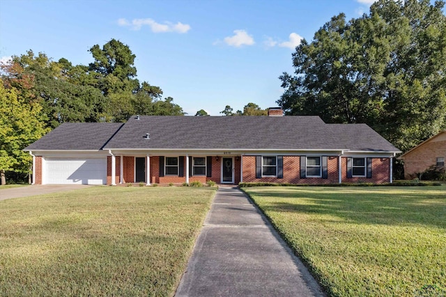 ranch-style home with a garage and a front lawn