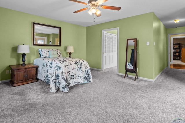 bedroom with ceiling fan, a closet, and light colored carpet