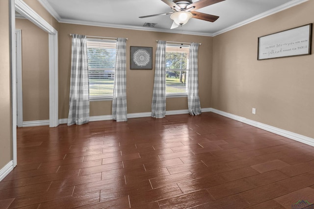 spare room featuring dark hardwood / wood-style flooring, crown molding, ceiling fan, and a healthy amount of sunlight