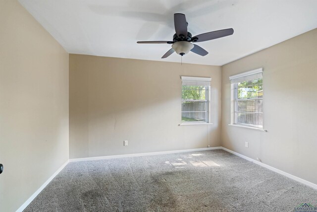 1130 Oakwood St, Carthage, TX 75633 - unfurnished room with carpet, ceiling fan, and baseboards