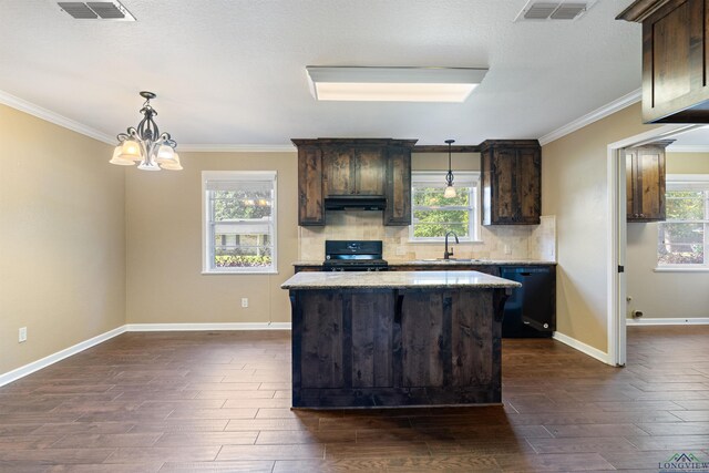 1130 Oakwood St, Carthage, TX 75633 - kitchen with dishwasher, range, dark brown cabinets, a sink, and dark wood finished floors