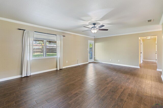 1130 Oakwood St, Carthage, TX 75633 - spare room with dark wood finished floors, ceiling fan, baseboards, and crown molding
