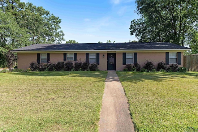 1130 Oakwood St, Carthage, TX 75633 - single story home with stucco siding