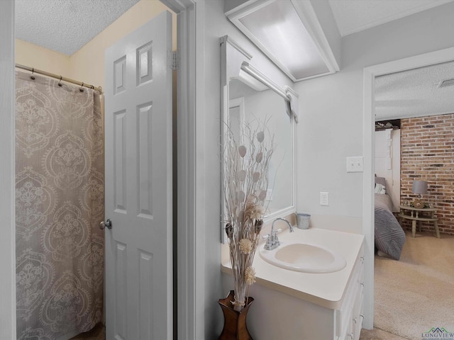 bathroom featuring vanity and a textured ceiling