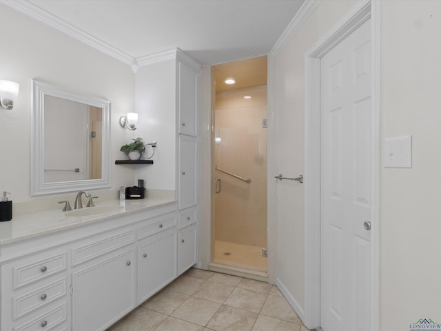 bathroom with vanity, tile patterned floors, a shower with door, and ornamental molding