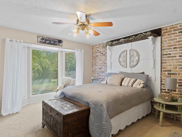 carpeted bedroom with ceiling fan and a textured ceiling