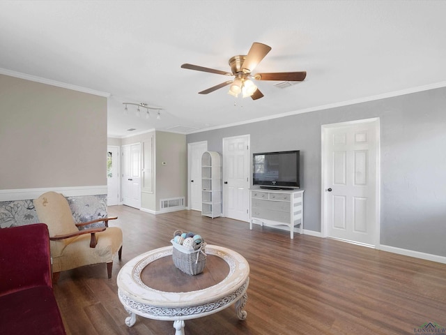 living room with dark hardwood / wood-style floors, ceiling fan, and crown molding