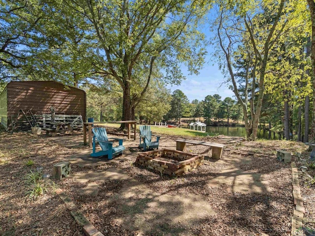 view of yard with a fire pit