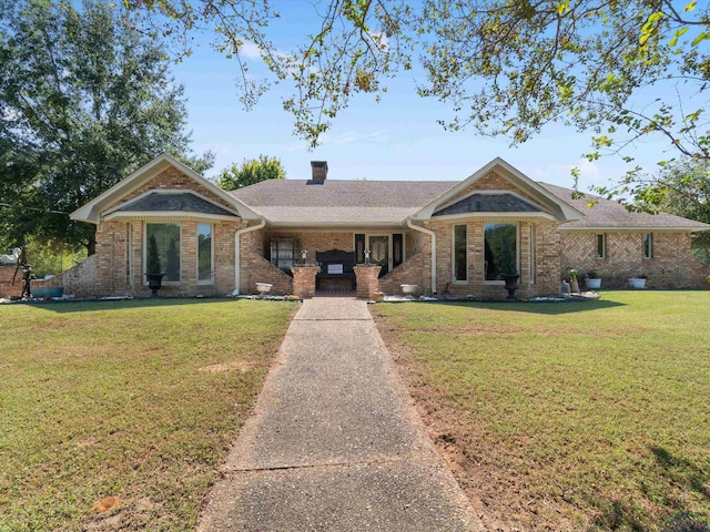 ranch-style house with a front lawn