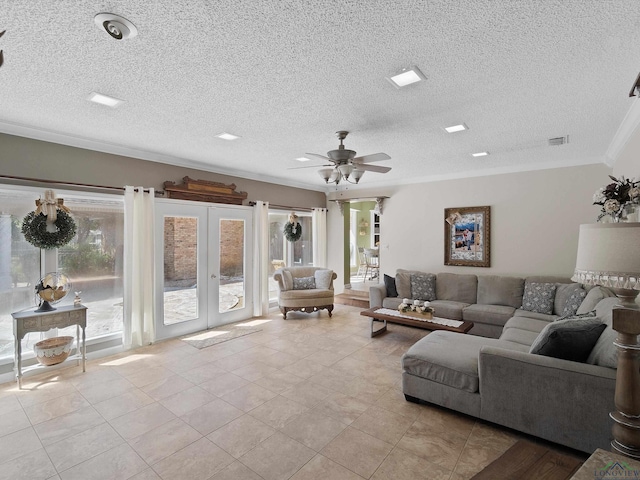 tiled living room with crown molding, french doors, ceiling fan, and a textured ceiling