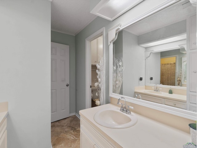 bathroom with vanity and a textured ceiling