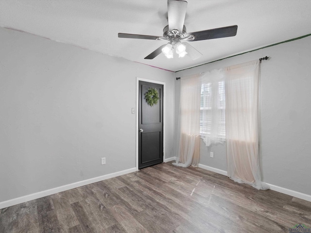 empty room with wood-type flooring, a textured ceiling, and ceiling fan