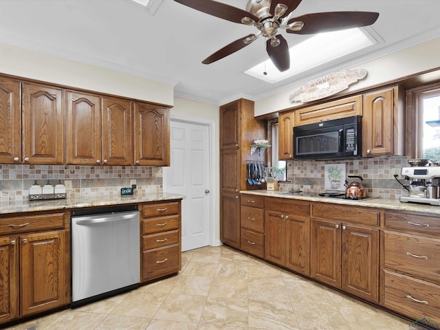 kitchen with backsplash, light stone counters, dishwasher, and gas cooktop