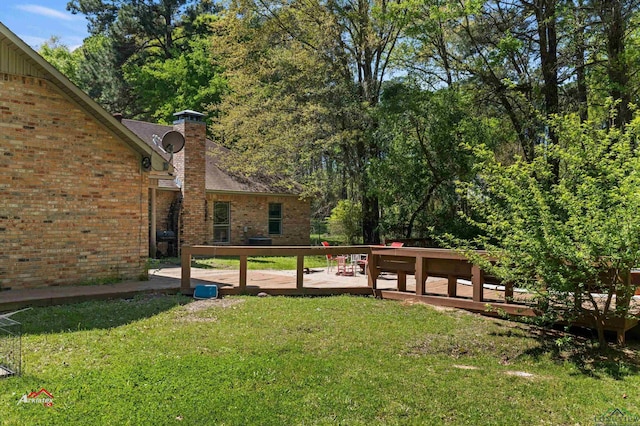 view of yard featuring a deck