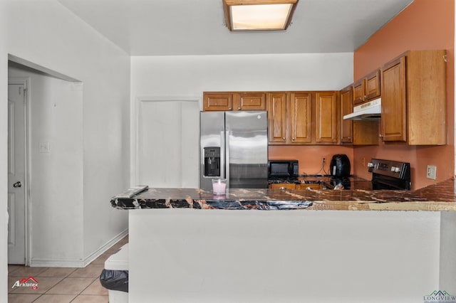 kitchen with black appliances, light tile patterned floors, and kitchen peninsula