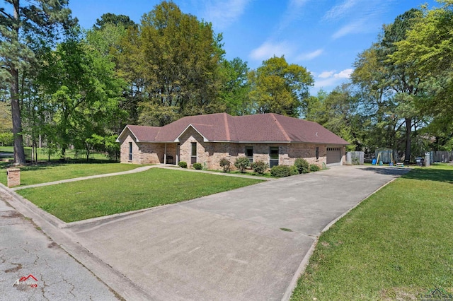 ranch-style house with a garage and a front lawn