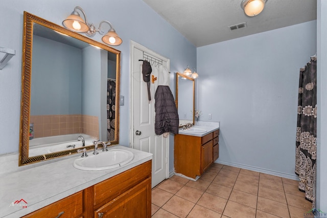 bathroom with vanity and tile patterned floors