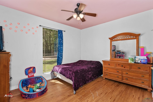 bedroom featuring ceiling fan and light wood-type flooring