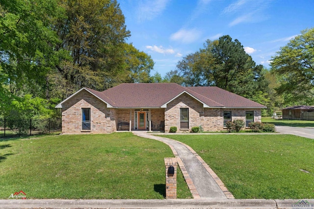 single story home featuring a front yard