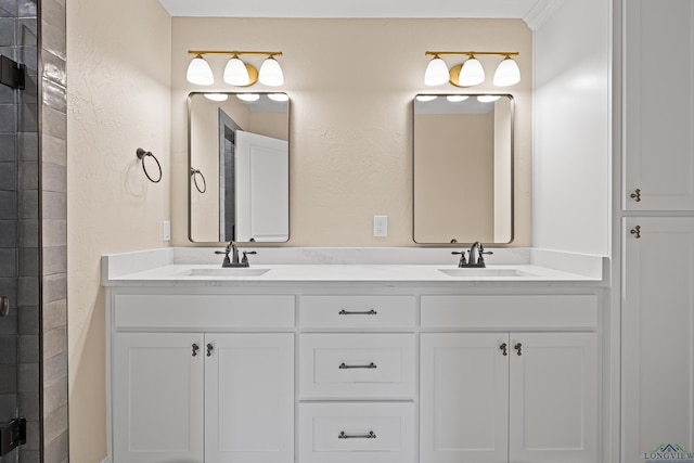 bathroom with vanity and a shower with door