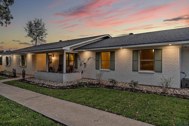 ranch-style house featuring a yard