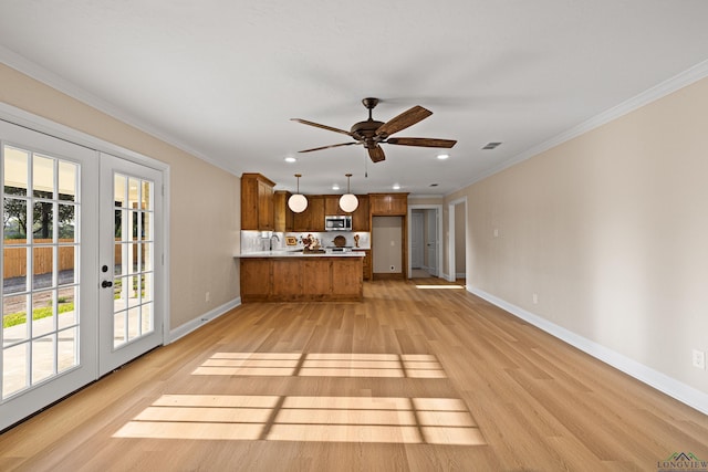 unfurnished living room with ceiling fan, french doors, light hardwood / wood-style flooring, and ornamental molding