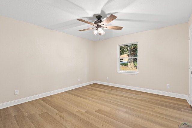 empty room featuring ceiling fan and light hardwood / wood-style flooring