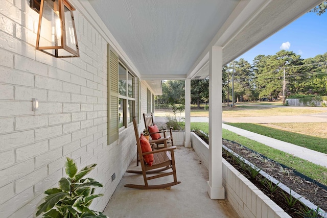 view of patio featuring a porch