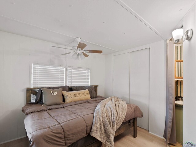 3065 E Lake, Gladewater, TX 75647 - bedroom with light wood-style flooring, a closet, and ceiling fan