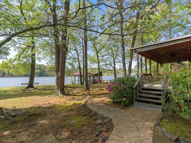 3065 E Lake, Gladewater, TX 75647 - view of yard with a ceiling fan and a water view