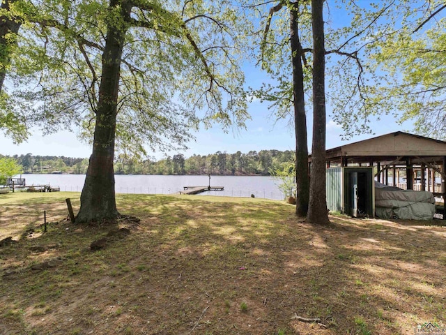 3065 E Lake, Gladewater, TX 75647 - view of yard featuring a water view, a dock, and a forest view