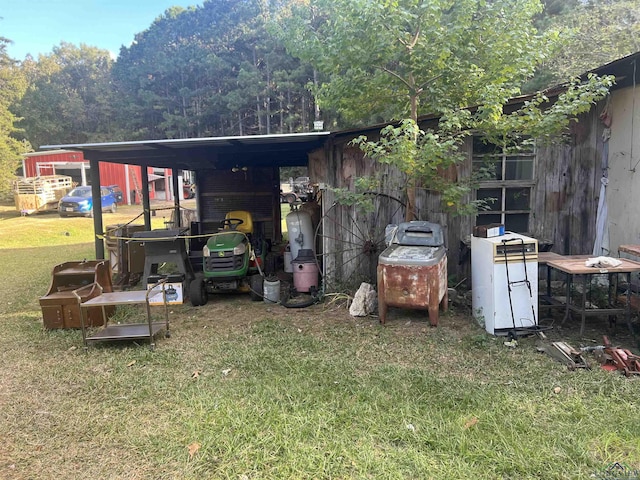 exterior space with a yard and a carport