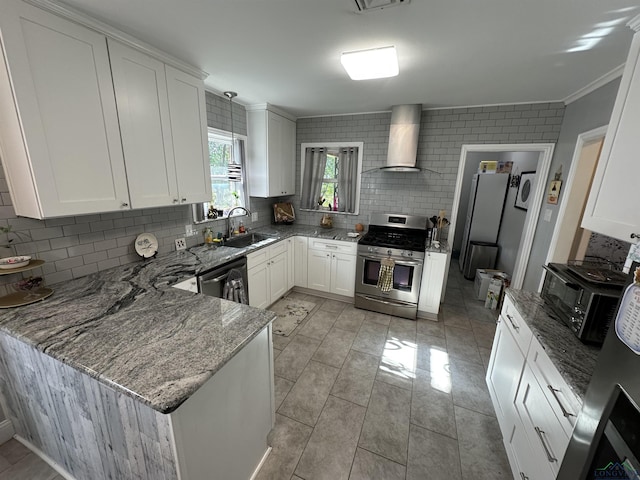 kitchen with wall chimney exhaust hood, stone countertops, stainless steel appliances, decorative backsplash, and white cabinets