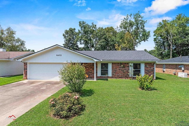 ranch-style home featuring a garage and a front yard